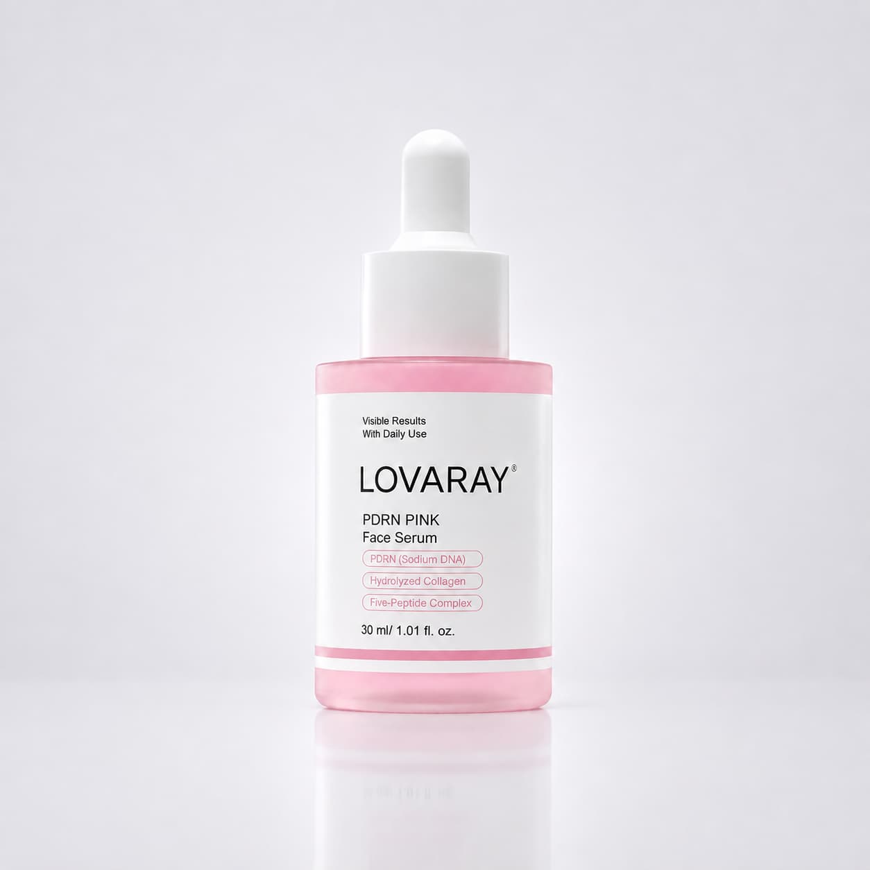 A bottle of LOVARAY PDRN PINK Face Serum with a white dropper cap and a pink liquid visible inside a clear bottle, set against a clean white background with a soft reflection.