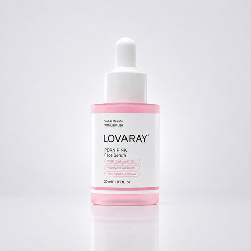 A bottle of LOVARAY PDRN PINK Face Serum with a white dropper cap and a pink liquid visible inside a clear bottle, set against a clean white background with a soft reflection.