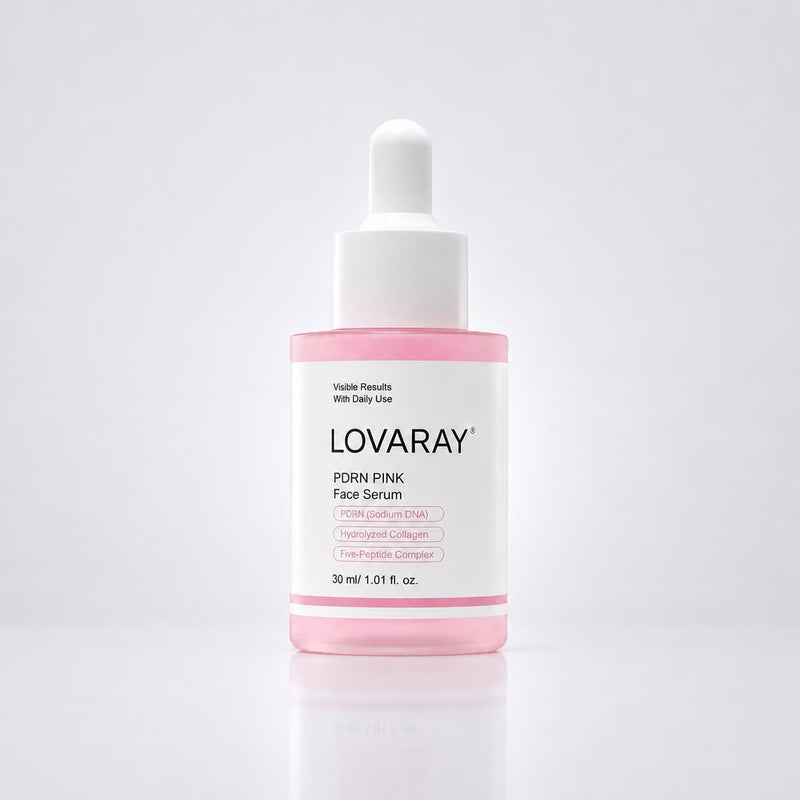 A bottle of LOVARAY PDRN PINK Face Serum with a white dropper cap and a pink liquid visible inside a clear bottle, set against a clean white background with a soft reflection.