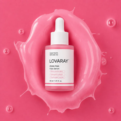 A bottle of LOVARAY PDRN Pink Face Serum centered on a glossy pink splash, with a white dropper cap and pink label accents.